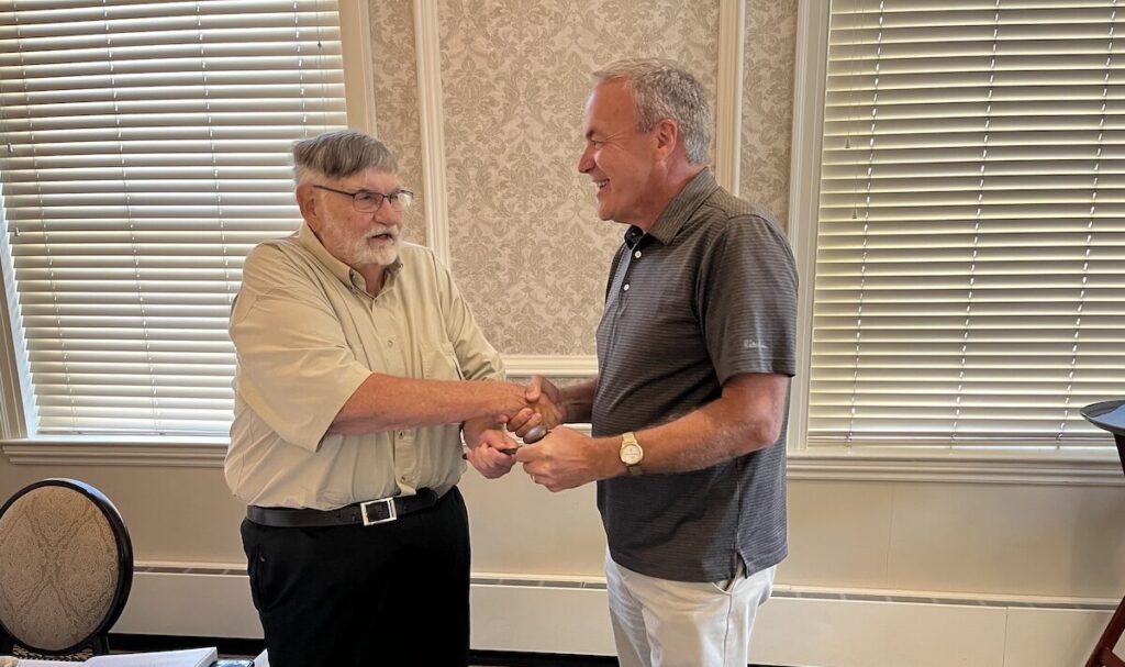 reilly passing gavel to stanley